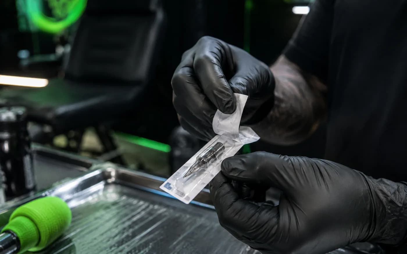 Sterile single use tattoo needle being opened in Bangkok studio