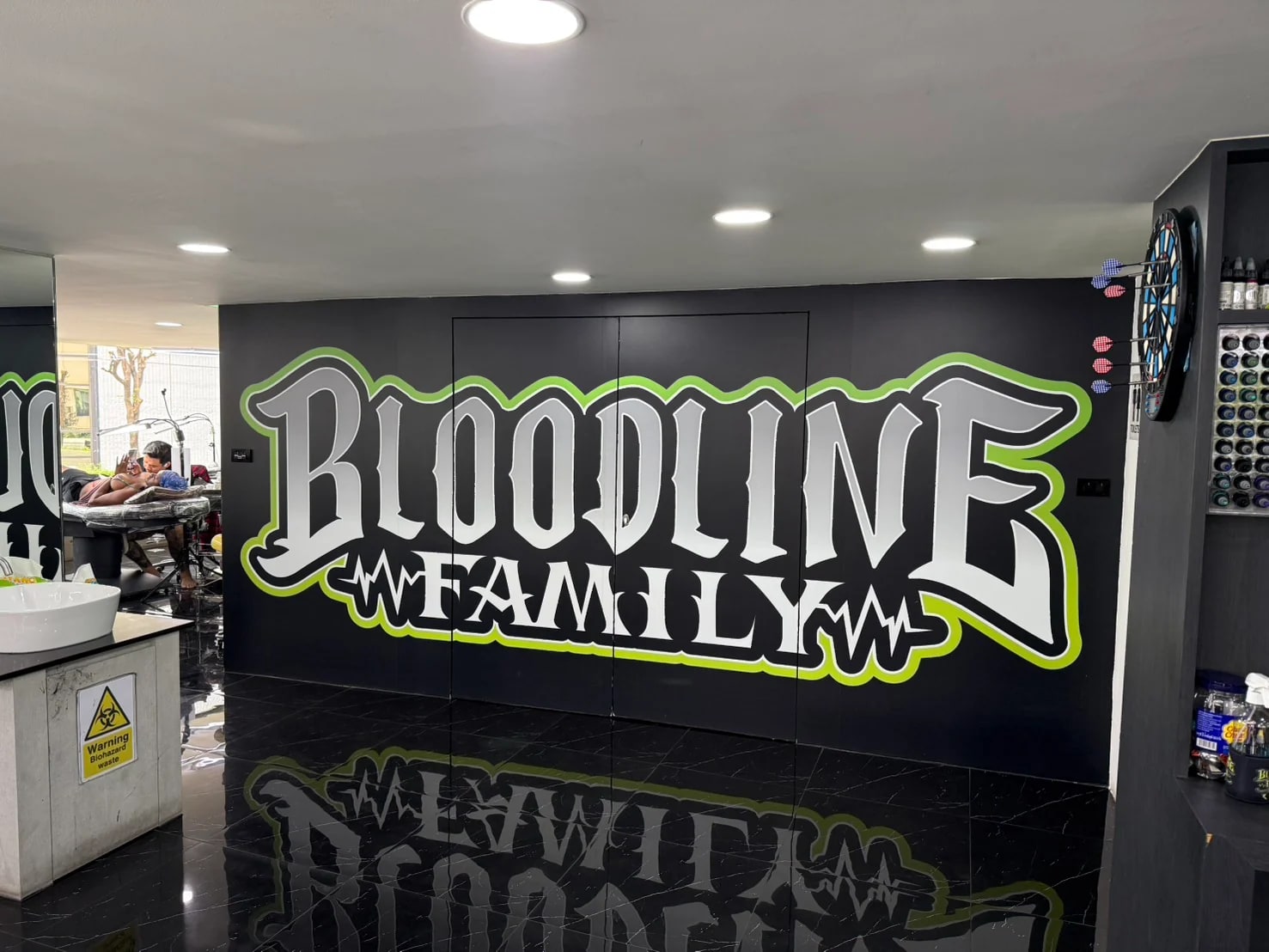 Bloodline Family wall inside a Bangkok appointment-only tattoo studio