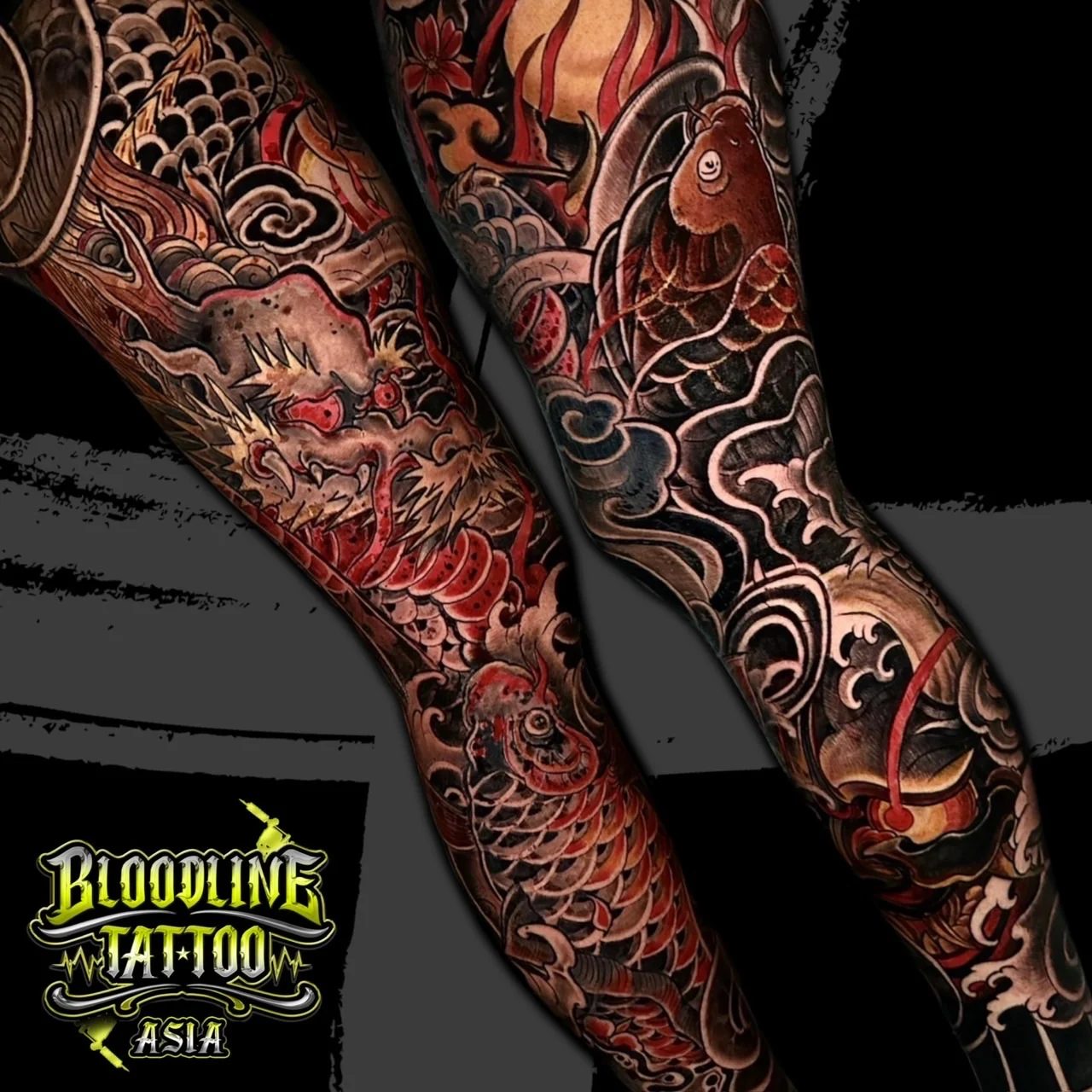 Colour Japanese Irezumi matching full leg sleeve tattoos with a red dragon, koi fish, waves, and a red sun at Bloodline Tattoo Bangkok.